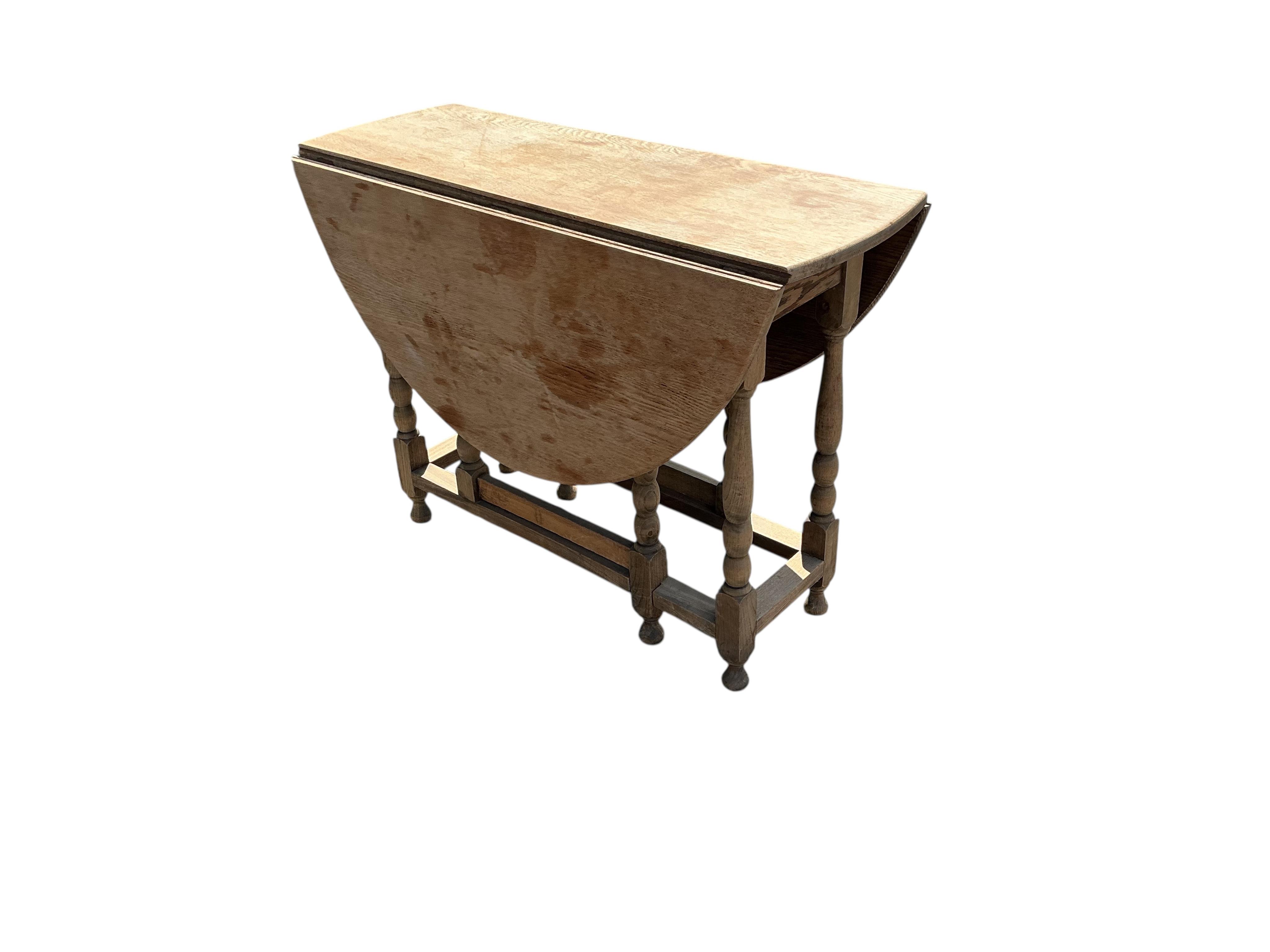 A bleached oak gateleg table, width 99cm, depth 37cm, height 72cm